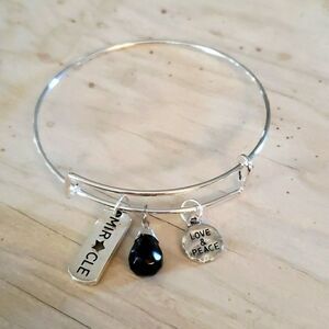 Bracelets by Sandra silver tone adjustable, miracle